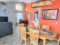 Bright dining room with a large table and orange walls at 8515 Sunrise Key Dr, Kissimmee, FL 34747