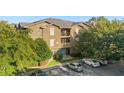 Tan condo building with ample parking and landscaping at 102 Vista Verdi Cir # 320, Lake Mary, FL 32746