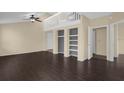 Living room with dark floors and loft area at 102 Vista Verdi Cir # 320, Lake Mary, FL 32746