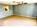Spacious living room with tile floors and ceiling fan at 12107 Bruceton Way # 102, Orlando, FL 32828