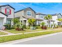 Street view of charming homes with palm trees and lush landscaping at 12754 Brodlove Ln, Winter Garden, FL 34787