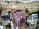 Aerial view of the property showcasing a pool, backyard, and proximity to other homes and greenery at 14101 Vista Del Lago Blvd, Clermont, FL 34711