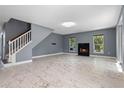 Bright and airy living room with marble floors and a cozy fireplace at 1595 Stone Trl, Deltona, FL 32725