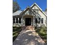 Stunning curb appeal! This home features a charming front entrance and manicured lawn at 6241 Blakeford Dr, Windermere, FL 34786