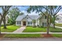 Charming two-story home with a landscaped lawn and inviting entrance at 6241 Blakeford Dr, Windermere, FL 34786