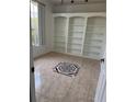 Bright office space with white built-in shelving and a decorative tile centerpiece at 63 York Ct, Kissimmee, FL 34758