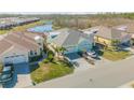 Community of two-story houses near a pond at 906 Coral Reef Way, Daytona Beach, FL 32124