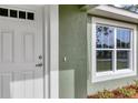 White front door and window with light green walls and trim at 10 Cedar Tree Dr, Ocala, FL 34472