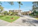 House exterior showcasing a driveway and gated entrance at 10125 Foxhurst Ct, Orlando, FL 32836