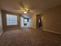 Spacious living room with carpet and ceiling fan at 11526 Westwood Blvd # 725, Orlando, FL 32821