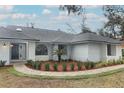 Newly painted exterior, walkway, and well-manicured landscaping at 1633 Cedar Glen Dr, Apopka, FL 32712