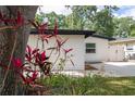Charming home featuring fresh paint, a new roof, and lush landscaping at 2002 Geigel Ave, Orlando, FL 32806