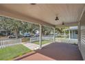 Spacious front porch with white columns, overlooking a tree-lined street at 219 Laurel Ave, Sanford, FL 32771