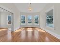 Bright living room with hardwood floors, bay windows, and fireplace at 219 Laurel Ave, Sanford, FL 32771