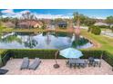 Backyard oasis featuring a pool, patio, and pond view at 278 Eaglet Way, Lake Mary, FL 32746