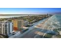 Stunning aerial view showcases beachfront condos along the coastline with ocean view at 2901 S Atlantic Ave # 702, Daytona Beach, FL 32118
