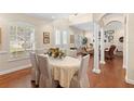 Formal dining room with hardwood floors and a beige table setting at 346 Calliope St, Ocoee, FL 34761