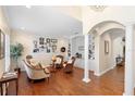 Spacious living room with hardwood floors and built in shelving at 346 Calliope St, Ocoee, FL 34761