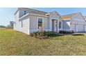 Charming single-story home showcasing well-maintained landscaping and a inviting facade at 5000 Northern Dove Ave, Mount Dora, FL 32757