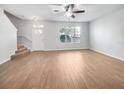 Spacious living room featuring hardwood floors and ample natural light at 510 Rainbow Springs Loop, Groveland, FL 34736