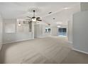 Open living room with high ceilings and a view of the backyard at 5803 Sw 107Th St, Ocala, FL 34476