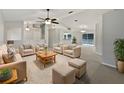 Bright living room features neutral colored furniture and a cozy atmosphere at 5803 Sw 107Th St, Ocala, FL 34476