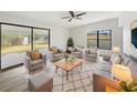 Bright living room with ample seating and access to backyard at 6117 Oakcrest Cir, Orlando, FL 32808