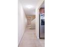 Carpeted hallway with view to stairs and kitchen at 112 Augustus Pt, Sanford, FL 32773