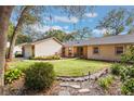 House exterior showcasing landscaping and stone pathway at 117 E Goodheart Ave, Lake Mary, FL 32746