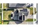 House with solar panels and a backyard, viewed from above at 14789 Milfoil Ave, Orlando, FL 32827