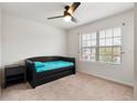 Small bedroom with a daybed and window at 309 Citrus Isle Loop, Davenport, FL 33837