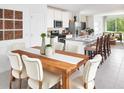 Bright dining room with wood table and seating for six at 4941 Kaia Ave, Winter Haven, FL 33884