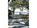 Private boat ramp leading to the lake, shaded by lush trees at 5416 Parkway Dr, Belle Isle, FL 32809