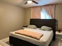 Comfortable bedroom with soft lighting and neutral tones at 5885 Dahlia Dr # 31/116, Orlando, FL 32807