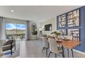 Bright dining area with wooden table and access to backyard at 6610 Leo Ln, St Cloud, FL 34773