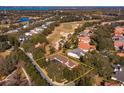 Breathtaking aerial view of property, golf course, and surrounding community at 6874 Valhalla Way, Windermere, FL 34786