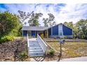 Newly renovated home with a charming white and blue exterior at 1720 Overlook Rd, Longwood, FL 32750