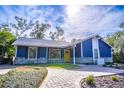 Newly renovated home with a charming white and blue exterior at 1720 Overlook Rd, Longwood, FL 32750