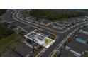 Aerial view showing a house with a pool and solar panels, in a neighborhood at 17584 Saw Palmetto Ave, Clermont, FL 34714