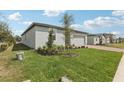 Well-maintained lawn and landscaping complement this modern home's exterior at 2361 White Tail St, Davenport, FL 33837