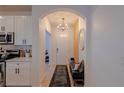 Welcoming entryway with stylish light fixture, bench, and decor accents that creates a warm ambiance at 2950 Timber Hawk Cir, Ocoee, FL 34761