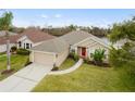 Aerial view showing house, landscaping, and a lake at 2984 Cedar Glen Pl, Oviedo, FL 32765