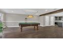 Game room featuring a pool table and hardwood floors at 3433 Glossy Leaf Ln, Clermont, FL 34711