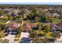 House with a large backyard and surrounding houses visible at 4029 Marina Isle Dr, Kissimmee, FL 34746