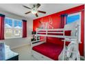 Bunk beds in a ' bedroom with a Spiderman mural at 7723 Graben St, Kissimmee, FL 34747