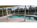 Relaxing kidney-shaped pool with screened enclosure at 7808 Rollingridge Ct, Orlando, FL 32835