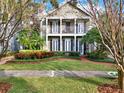 Two-story house with a front porch and well-manicured lawn at 833 Ellwood Ave, Orlando, FL 32804