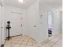 Bright entryway with tile flooring, closet, and view into other rooms at 905 Suwannee Dr, Apopka, FL 32703