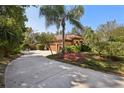 Home exterior showcasing a three-car garage and a long driveway at 10 Broadwater Dr, Ormond Beach, FL 32174