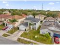 Two-story house, gray roof, driveway, and green lawn in a residential neighborhood at 1255 Blackwater Pond Dr, Orlando, FL 32828